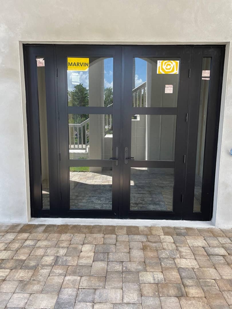 Marvin glass doors being installed in a residential Fort Myers home